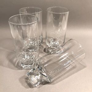 Set of four modern wine glasses with glass cube base